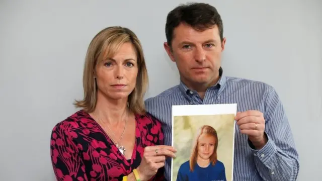 Kate and Gerry McCann holding a computer-generated image of Madeleine