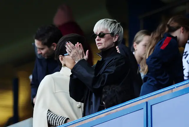 Megan Rapinoe applauds from the stands