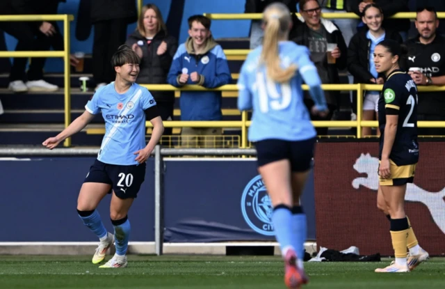 Manchester City's Aoba Fujino (left) celebrates