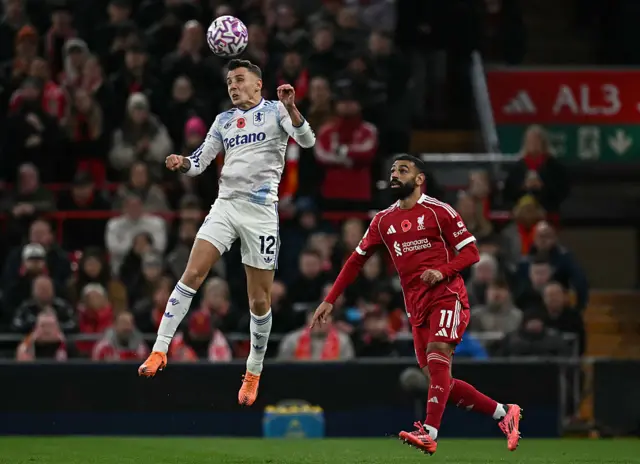 Liverpool's Egyptian striker #11 Mohamed Salah (R) vies with Aston Villa's French defender #12 Lucas Digne during the English Premier League football match between Liverpool and Aston Villa at Anfield in Liverpool, north west England on November 1, 2025.