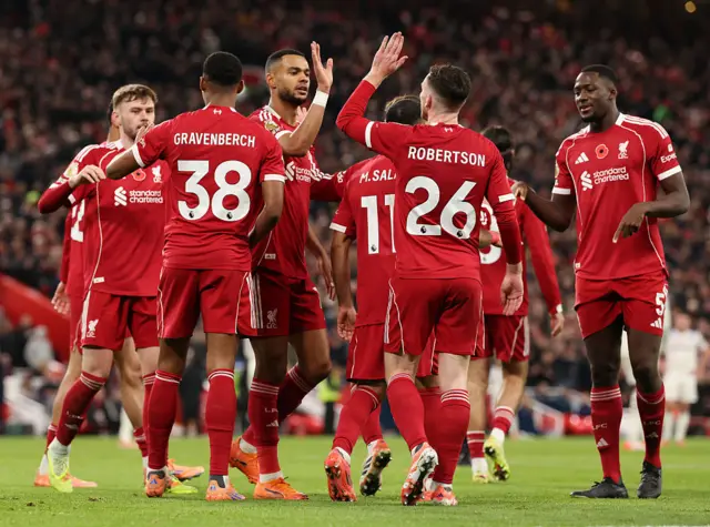 Ryan Gravenberch of Liverpool celebrates scoring his team's second goal with teammates during the Premier League match between Liverpool and Aston Villa at Anfield on November 01, 2025 in Liverpool, England.