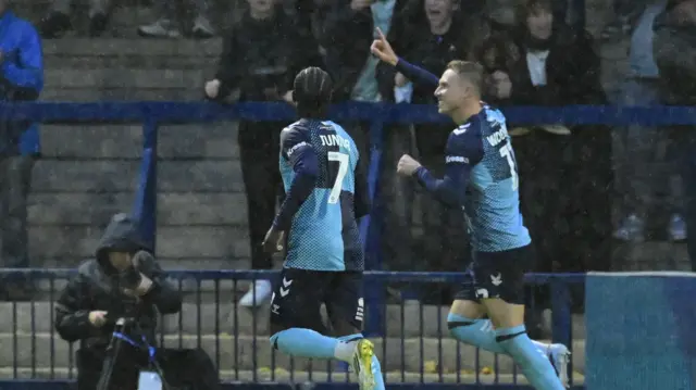 Cauley Woodrow celebrates scoring for Wycombe