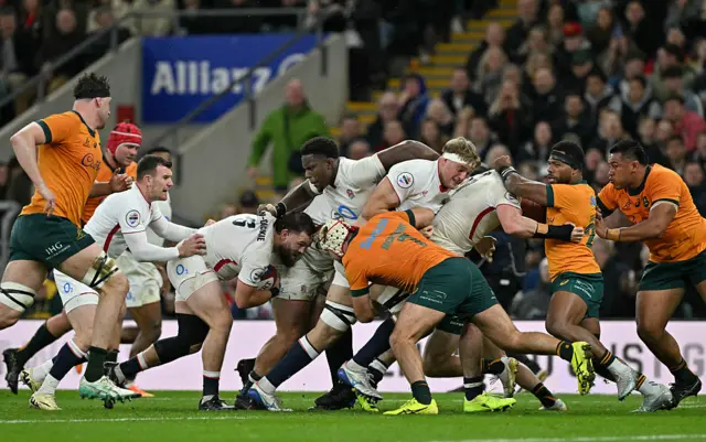 England's Luke Cowan-Dickie (4L) hlds the ball in a maul before scoring the team's fourth try during the Autumn Nations Series international rugby union match between England and Australia