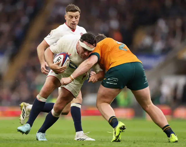 jamie George of England is tackled by Billy Pollard of Australia