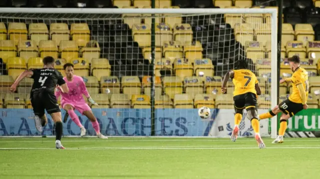 Graham Carey scores a penalty for Livingston against Hibernian