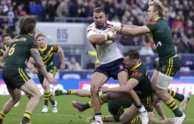England's Mike McMeeken is tackled by Australia's Angus Crichton (centre) and Lindsay Smith
