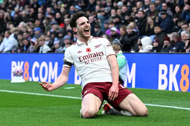 Declan Rice slides to celebrate