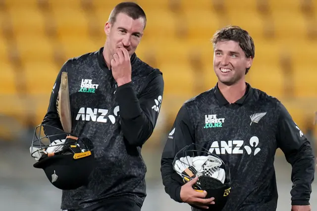 Blair Tickner and Zak Foulkes walk off after wrapping up victory for New Zealand
