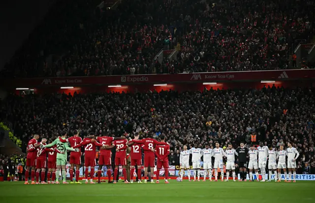 Players observe a minute's silence for Remembrance Day ahead of the English Premier League football match between Liverpool and Aston Villa at Anfield in Liverpool, north west England on November 1, 2025.