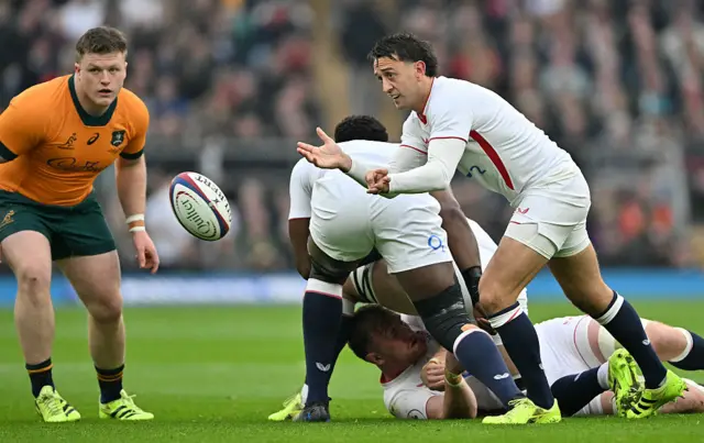 England's scrum-half Alex Mitchell passes the ball during the Autumn Nations Series international