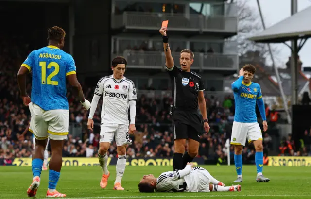 Emmanuel Agbadou is shown a red card