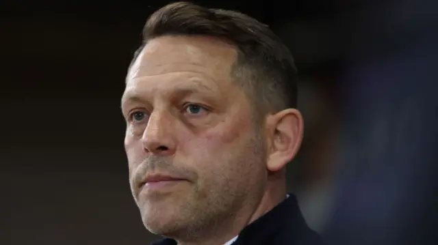 Leam Richardson looks on from the touchline.