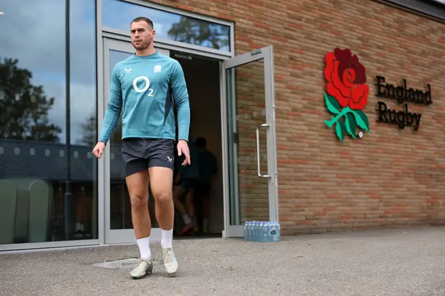 Tom Roebuck of England makes his way out of the changing room during the England training session