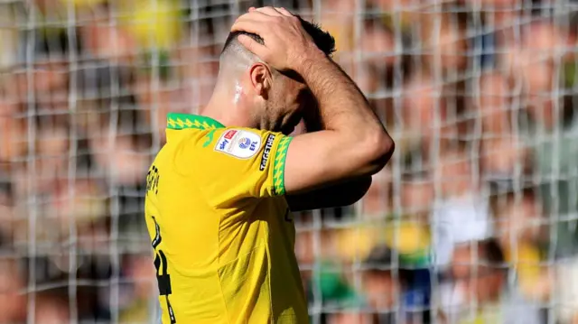 Norwich's Shane Duffy holds his head in his hands after seeing a header saved