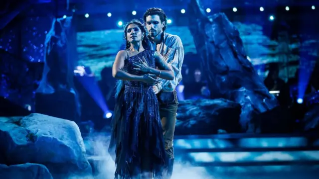 Balvinder and Julian are dressed in romantic, beauty and the beast-esque, ensembles