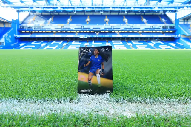 The matchday programme on the pitch