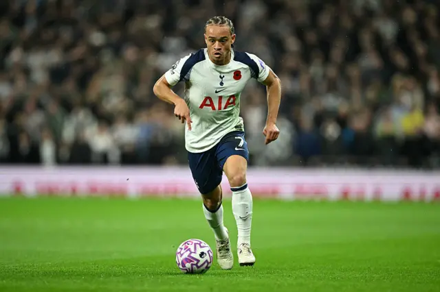 Tottenham Hotspur's Dutch midfielder #07 Xavi Simons runs with the ball