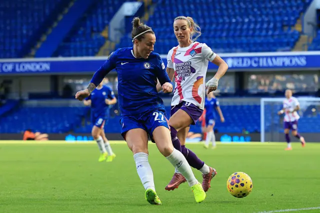 Lucy Bronze of Chelsea is put under pressure by Kosovare Asllani