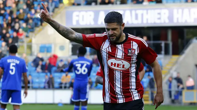 Danny Andrew celebrates scoring for Exeter at Halifax