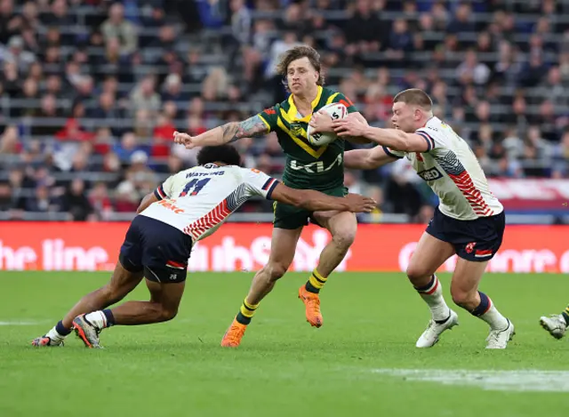 Kai Peerce-Paul (R) and Morgan Smithies of England in action with Cameron Munster
