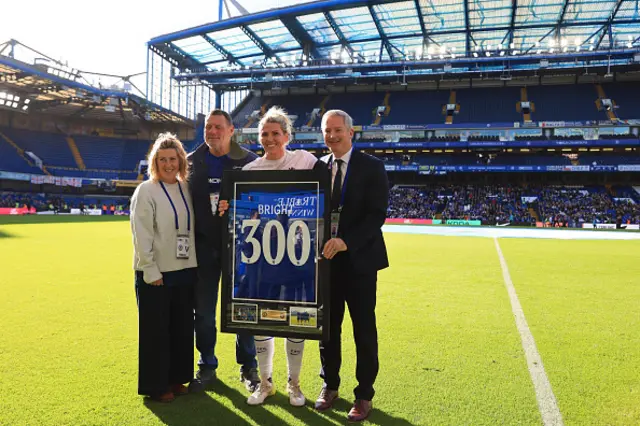 Millie Bright of Chelsea is presented with a framed shirt marking her 300th appearance