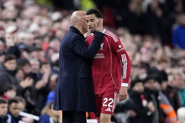 Liverpool manager Arne Slot (left) embraces Hugo Ekitike after he is substituted