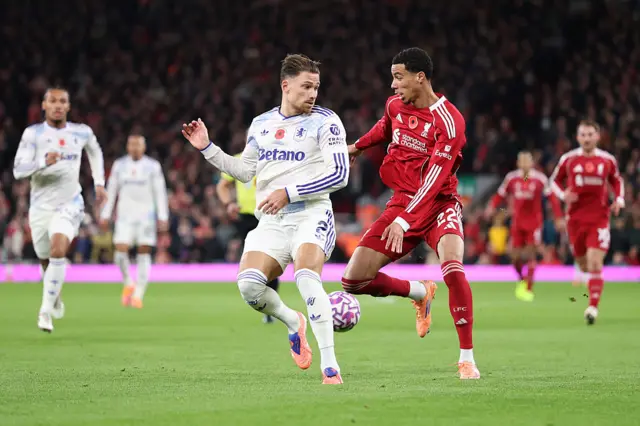 Hugo Ekitike of Liverpool is challenged by Matty Cash of Aston Villa during the Premier League match between Liverpool and Aston Villa at Anfield on November 01, 2025 in Liverpool, England.