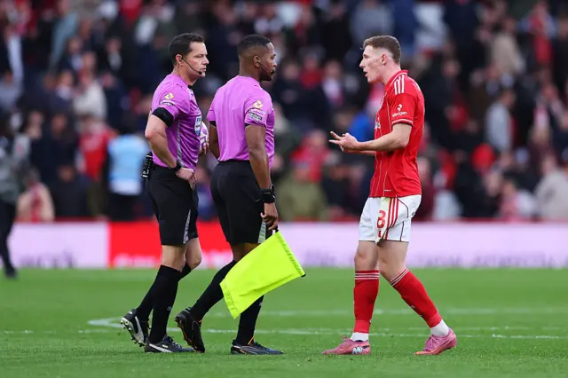 Elliott Anderson addresses the referees