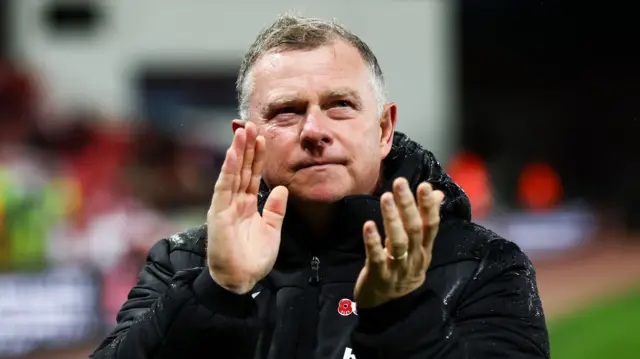 Mark Robins applauds Stoke fans