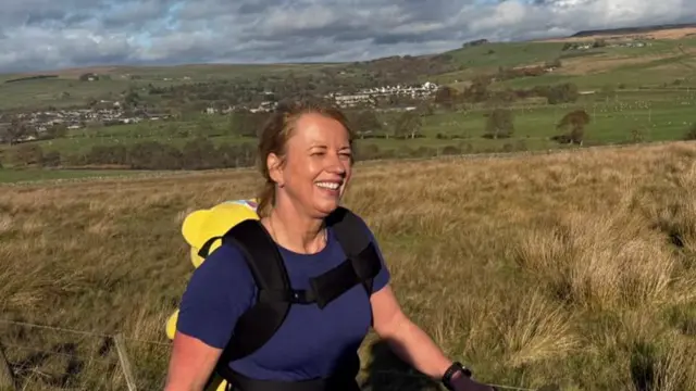 Sara smiling while she walks