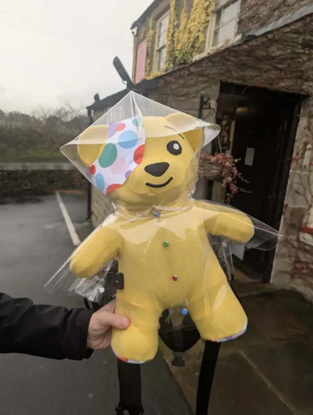Pudsey in his raincoat