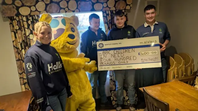 Whitley Young Farmers Association hold a cheque for £400
