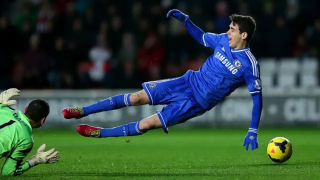 Oscar of Chelsea goes down in the area after seemingly making contact with goalkeeper Kelvin Davis of Southampton
