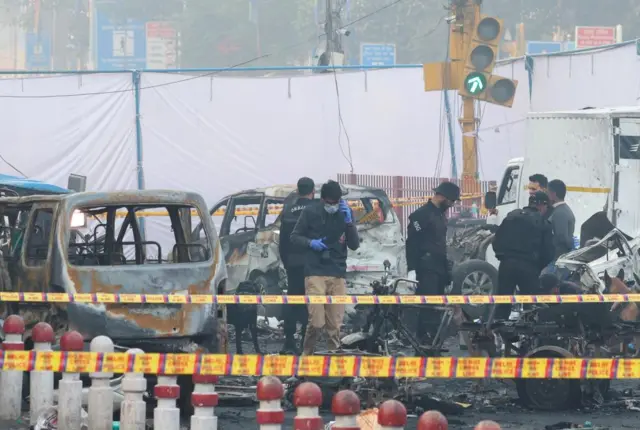general Investigators at the scene of an explosion in Delhi, where the wreckage of vehicles remains this morning
