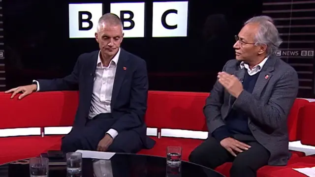 Tim Davie sat next to Shah on red sofa