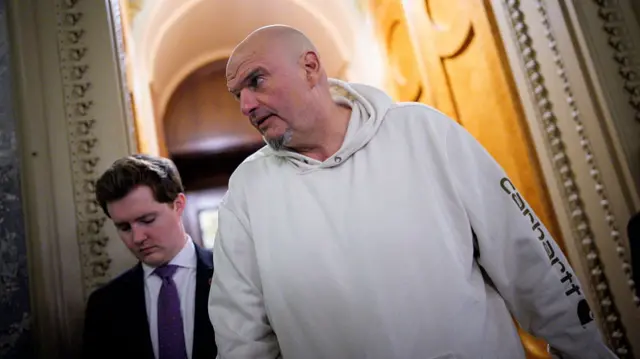 John Fetterman wears a white hoodie in the US Capitol