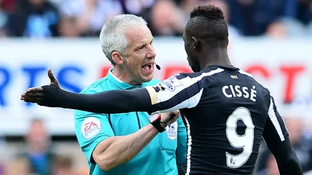 Chris Foy and Newcastle's Papiss Cisse