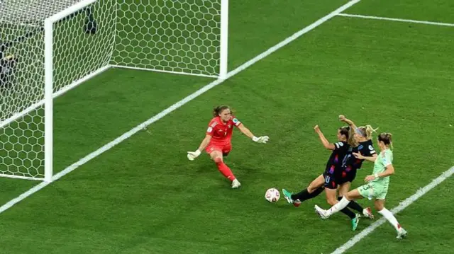 Chloe Kelly scores for England against Italy in the semi-final of Euro 2025 after her penalty was saved