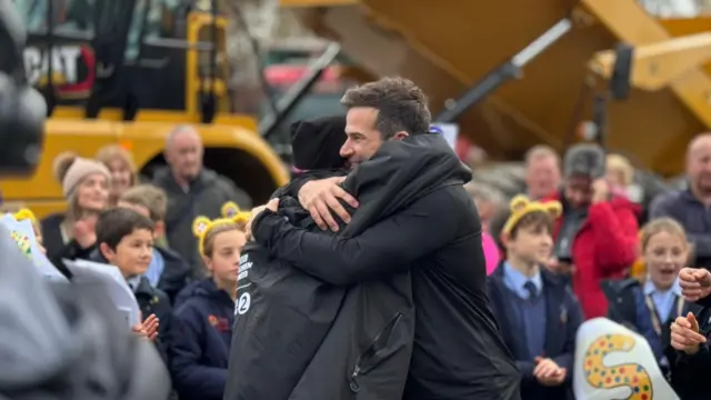Sara and Gethin hug