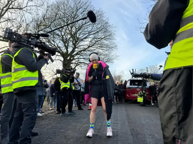 Sara smiles as she finds out she's reached over £1M in fundraising for Children in Need