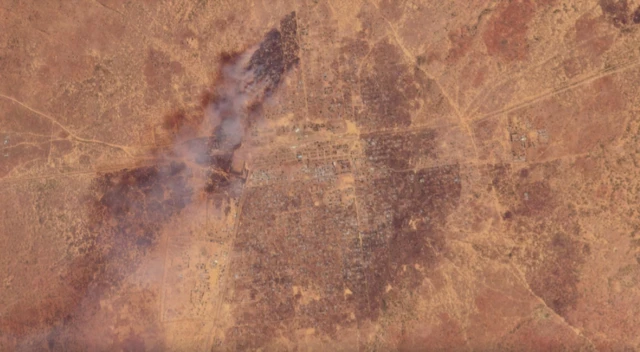 Satellite imagery shows smoke rising over large patches of land around the city of Babanusa