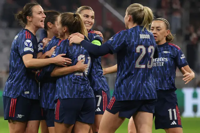 Arsenal's Spanish midfielder #08 Mariona Caldentey (hidden) celebrates scoring the 0-2 goal