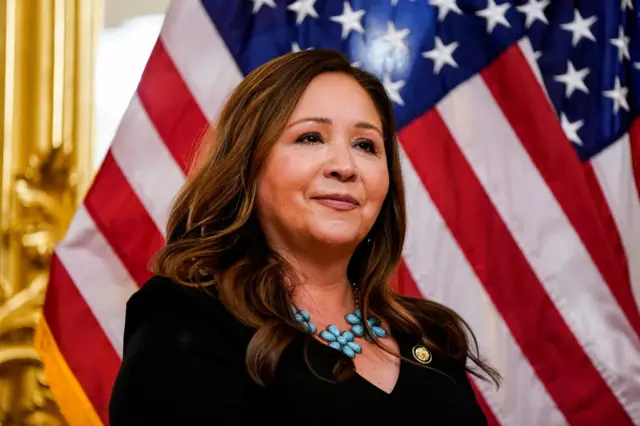 U.S. Representative Adelita Grijalva looks on, as she is ceremonially sworn in front of a USA flag