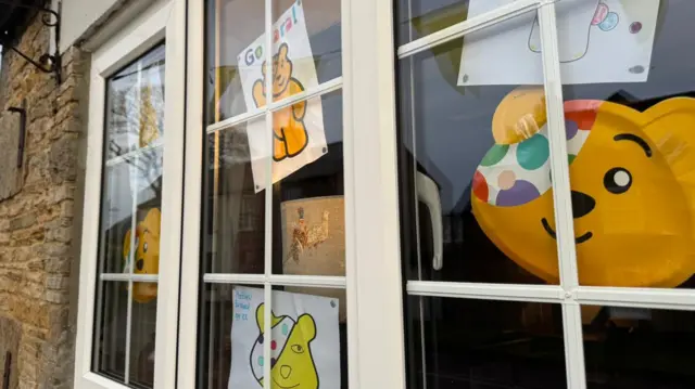 A window decked out in Pudsey pictures for Sara