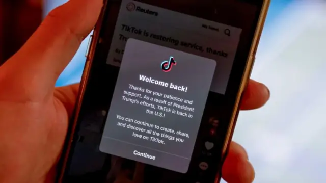 'Welcome back' message on TikTok app displayed on phone, following Trump TikTok deal