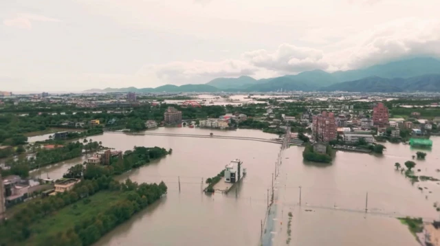 Drone footage that shows large parts of farm land submerged in floodwater in Yilan Country of Taiwan due to strong rainfall brought by Typhoon Fung-wong.