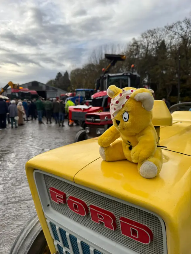 A vintage Pudsey bear surrounded by vintage tractors in Winston County Durham
