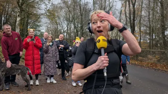 Sara reacts with joy to her new total
