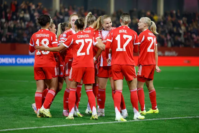 Bayern Munich's Danish forward #21 Pernille Harder (R) celebrates with team mates after scoring the opening 1-0 goal during the UEFA Women's Champions League, league phase football match between FC Bayern Munich and Juventus in Munich, southern Germany, on October 16, 2025.