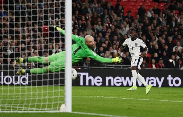 Bukayo Saka of England scores